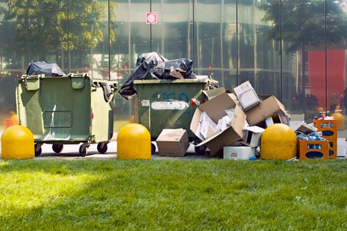 Workers managing construction debris for waste clearance